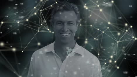 animation of portrait of smiling businessman over network of connections with glowing spots