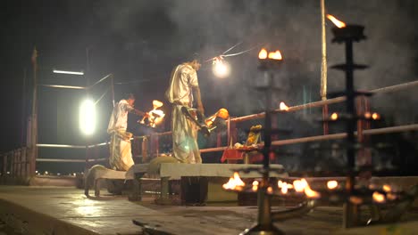 focus-pull on ganga aarti ceremonial candelabras