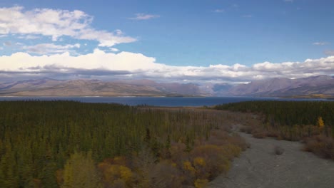 calm kluane lake with scenic mountains background