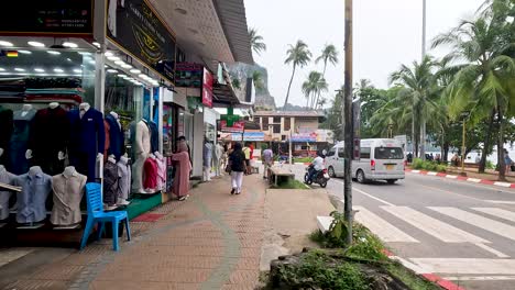 people and vehicles on a busy street