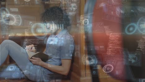 Round-scanners-and-data-processing-over-caucasian-male-student-studying-in-library-at-college