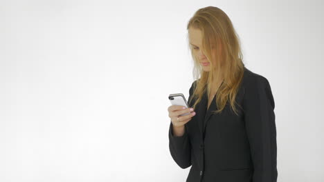 In-studio-a-young-girl-working-on-a-mobile-phone