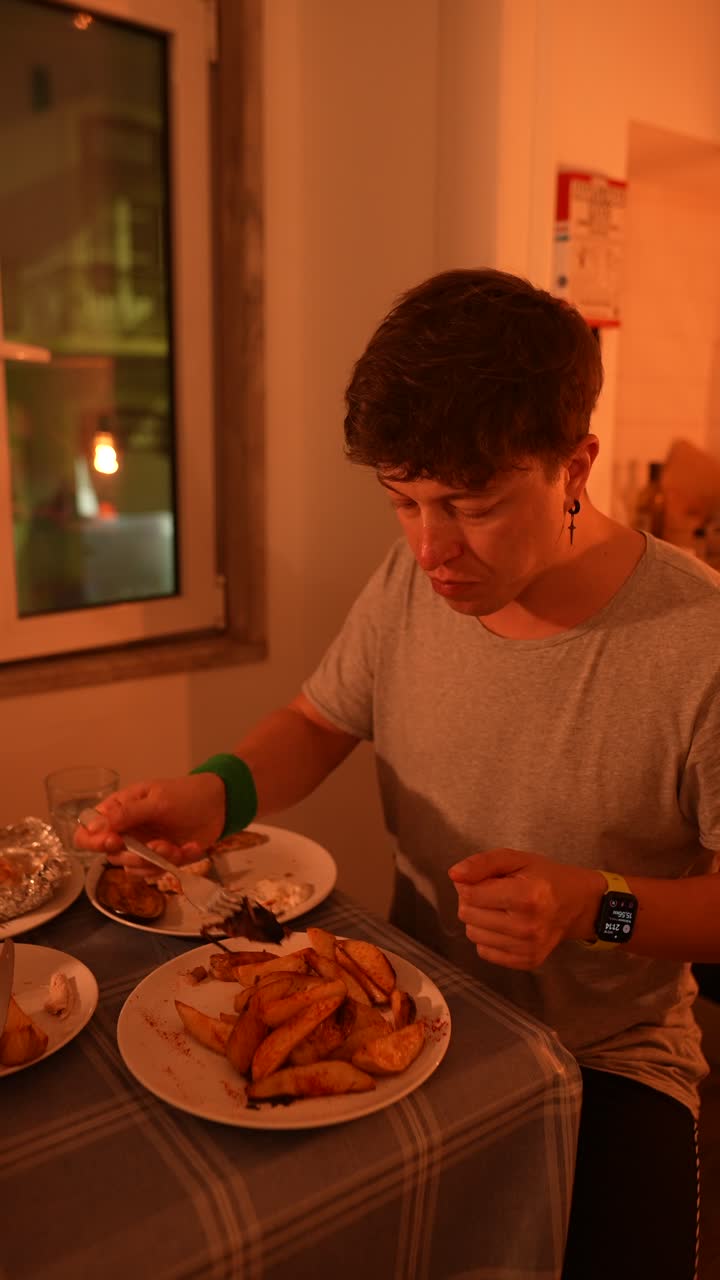 Person enjoying a meal at a table