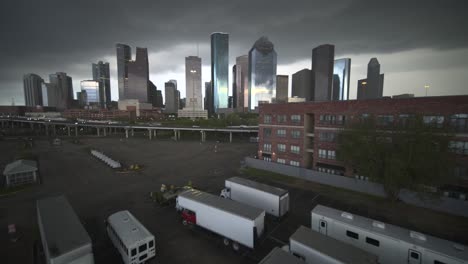 Wide-angle-drone-view-of-downtown-Houston,-Texas-on-a-dark-cloudy-day