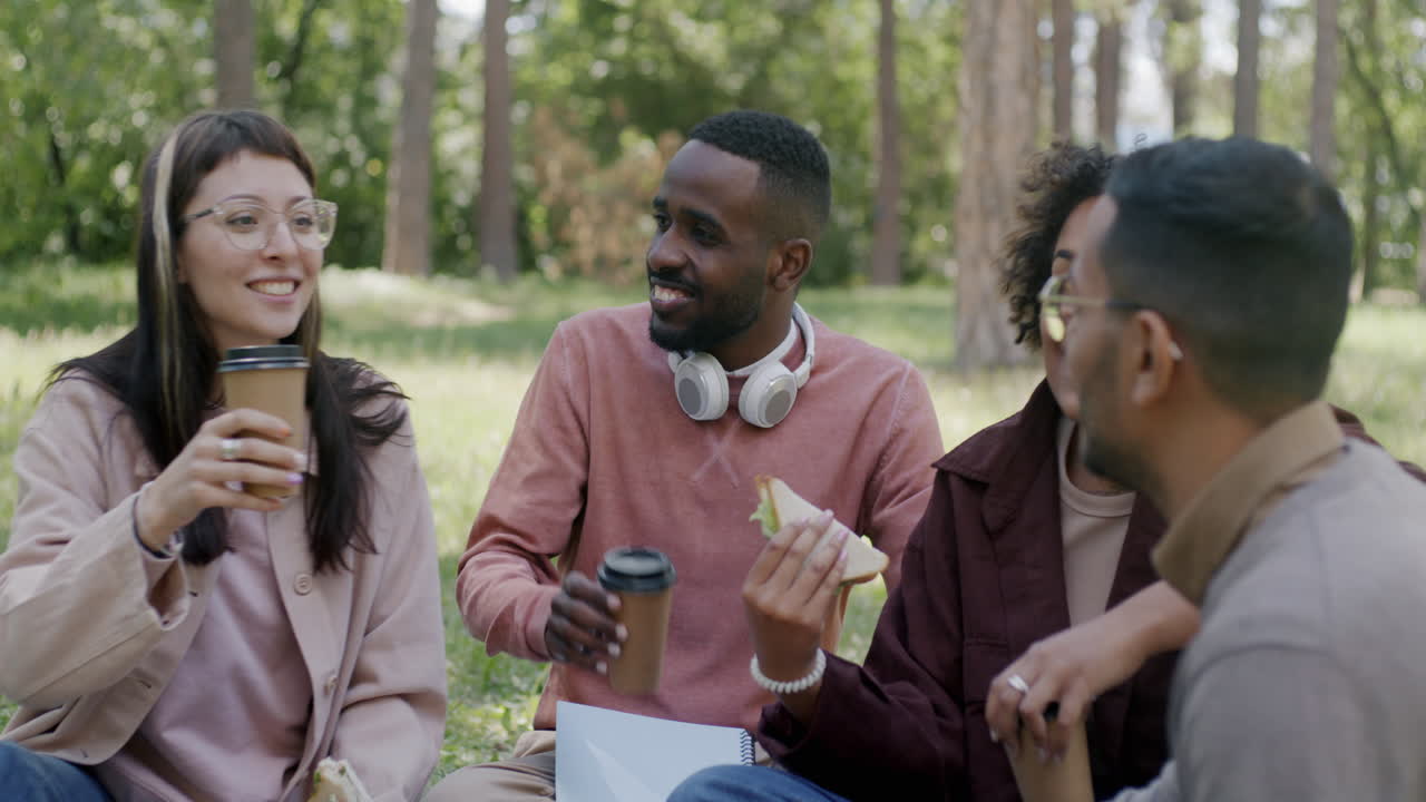 Friends enjoying a coffee break in the park