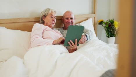 senior, couple and tablet in bed smile