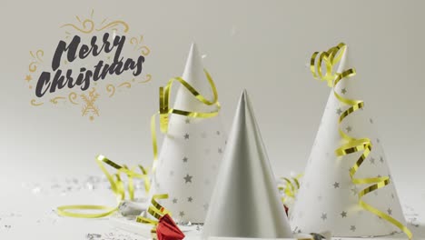 Animation-of-christmas-greetings-text-over-christmas-party-hats