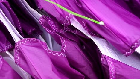 close up of a paraglider wing equipment, showing the lines and fabric in detail