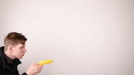 man with fake banana gun on lookout