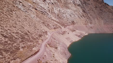 hikers at the andean mountains track on embalse