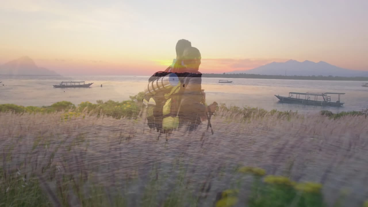 Hikers hiking lakeside at sunset, showing health app animated heart icon and fitness overlay