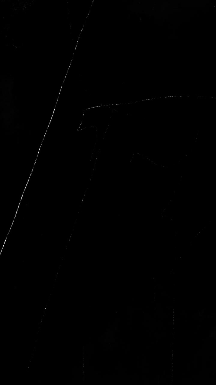 Abstract Light Trails Moving Against a Black Background