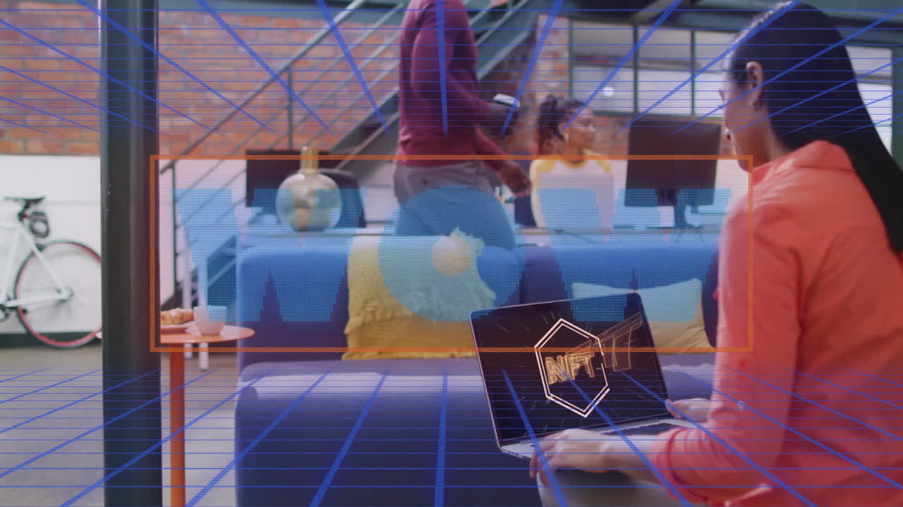 People working in modern office with NFT text animation over blue grid