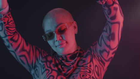 stylish woman in neon lighting
