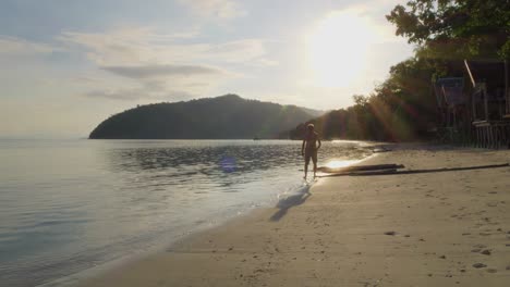 A-serene-sunrise-beach-scene-on-Kri-Island-in-Raja-Ampat,-Indonesia