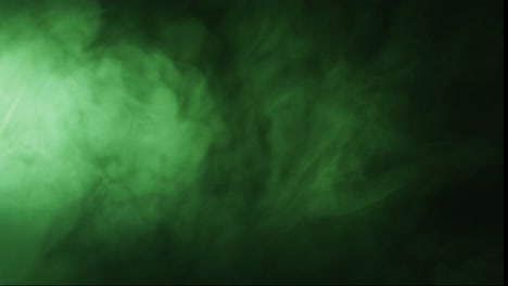 Video-of-green-clouds-of-smoke-moving-with-copy-space-on-black-background
