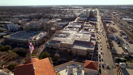 aerial-pullout-past-american-flag-in-modesto-california