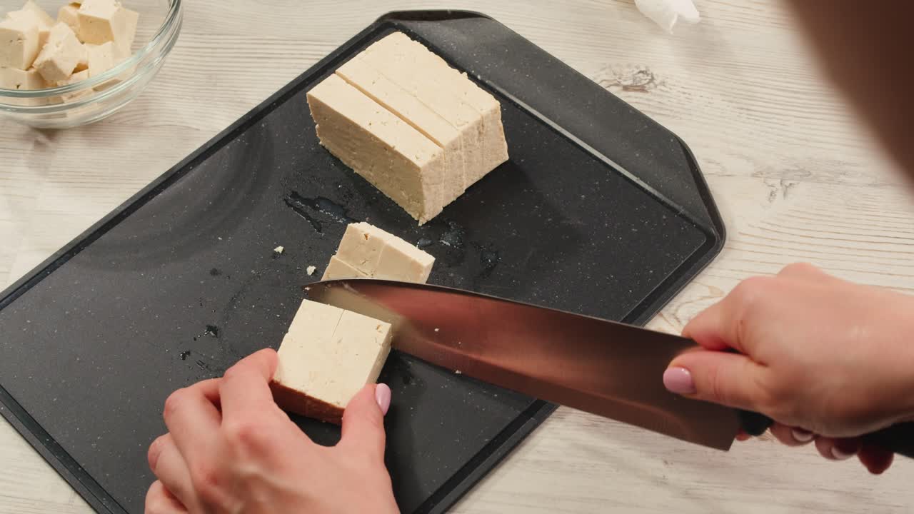 Cutting tofu into cubes