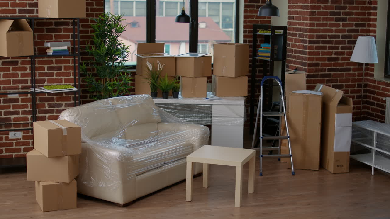 Homeowners moving in new apartment with boxes and sharing a kiss