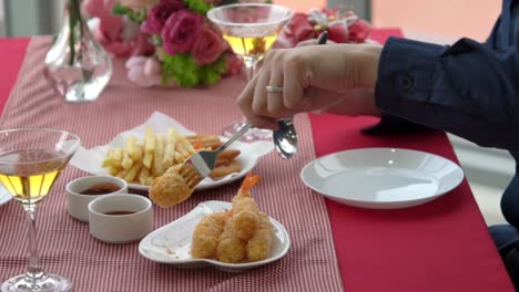 happy romantic couple eating lunch at restaurant