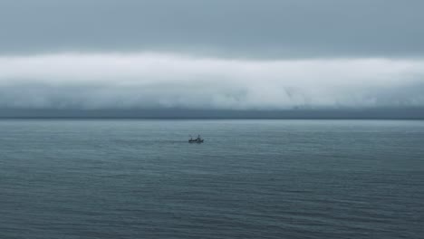 Fishing-Boat-Sailing-At-The-Saint-Lawrence-River-On-A-Gloomy-Day-In-Quebec,-Canada