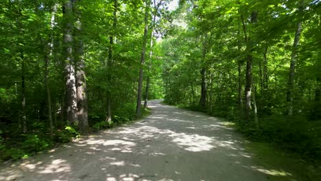 aerial flythrough wooded bikepath - battelle darby creek metro park