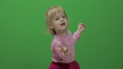 Happy-three-years-old-girl.-Cute-blonde-child.-Dancing-and-make-faces