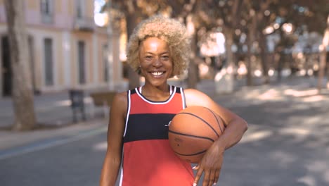 black basketball player in court outdoors