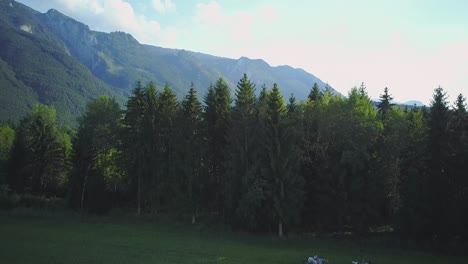 A-drone-shot-of-two-girls-riding-on-horses-across-a-field