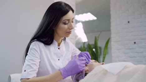hands of cosmetologist making injection in face. rejuvenating facial injections. aesthetic cosmetology.