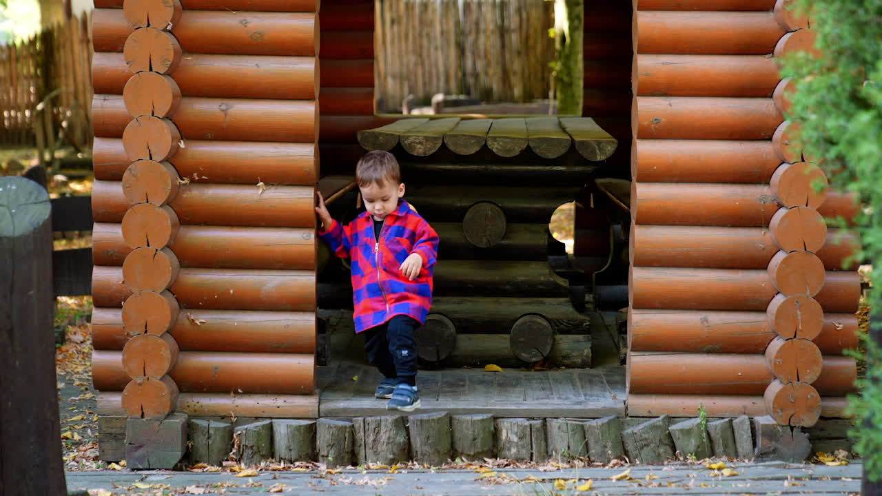 Summer outside having fun. Stylish little boy walking.