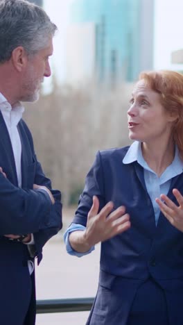 business professionals engaging in conversation outdoors