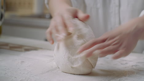 kneading pizza dough by hand