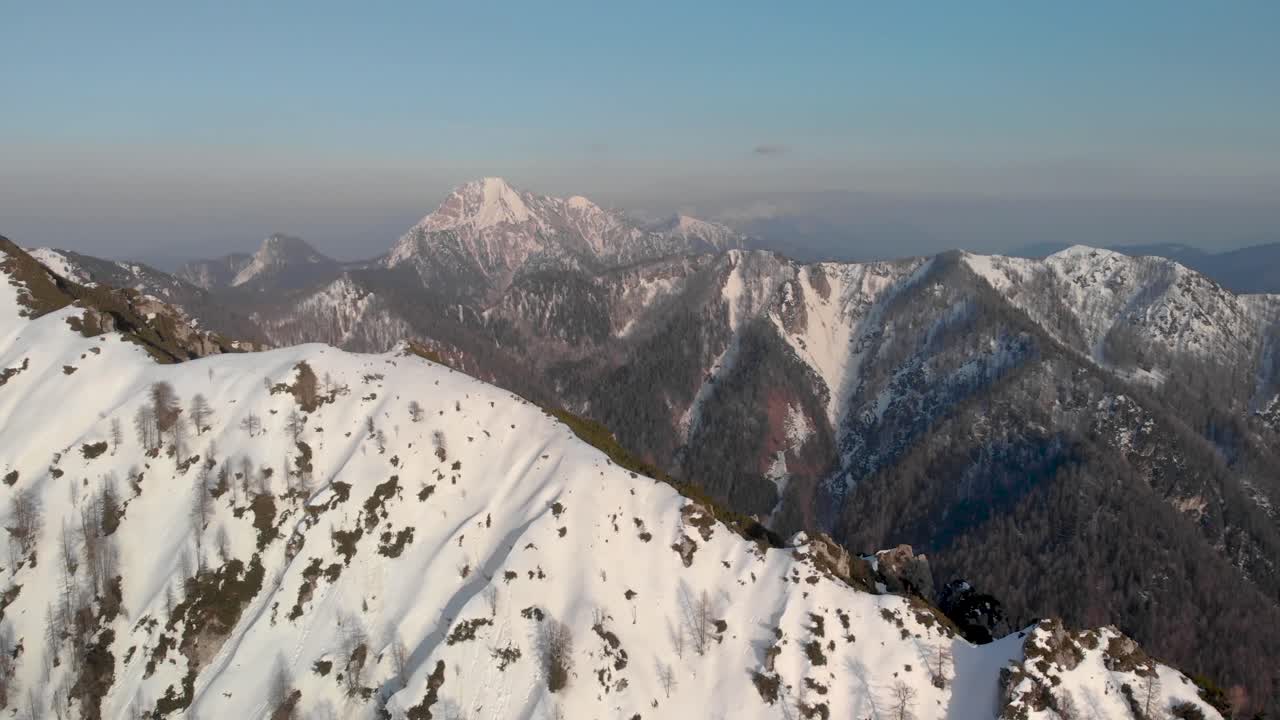 Aerial view of the Karavanke Alps in the winter on a clear skies day