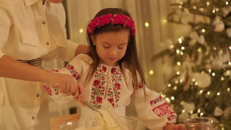 mother and daughter preparing for christmas celebration