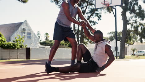 two athletes supporting each other on the basketball court