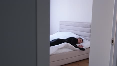 a tired guy an office worker goes to bed without undressing a tired guy an office worker goes to bed without undressing an overtired man after a hard days work video