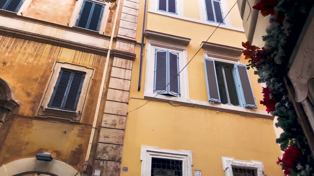 Christmas Decor At The Door Of An Establishment In The Corner Alley In Rome, Italy - close up panning shot