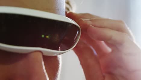 young man using the virtual reality video glass