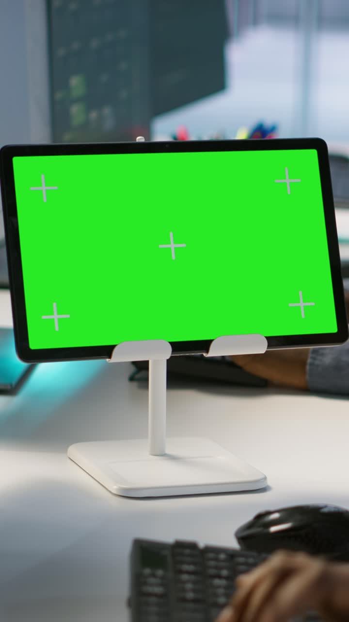 Vertical video Data center software developers using chroma key tablet