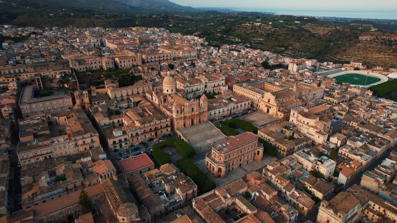 Architectural drone footage of baroque Noto and its iconic cathedral San Nicolò by scenic sunset. Sicily.