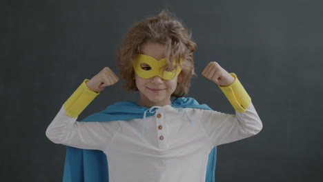 child dressed as superhero