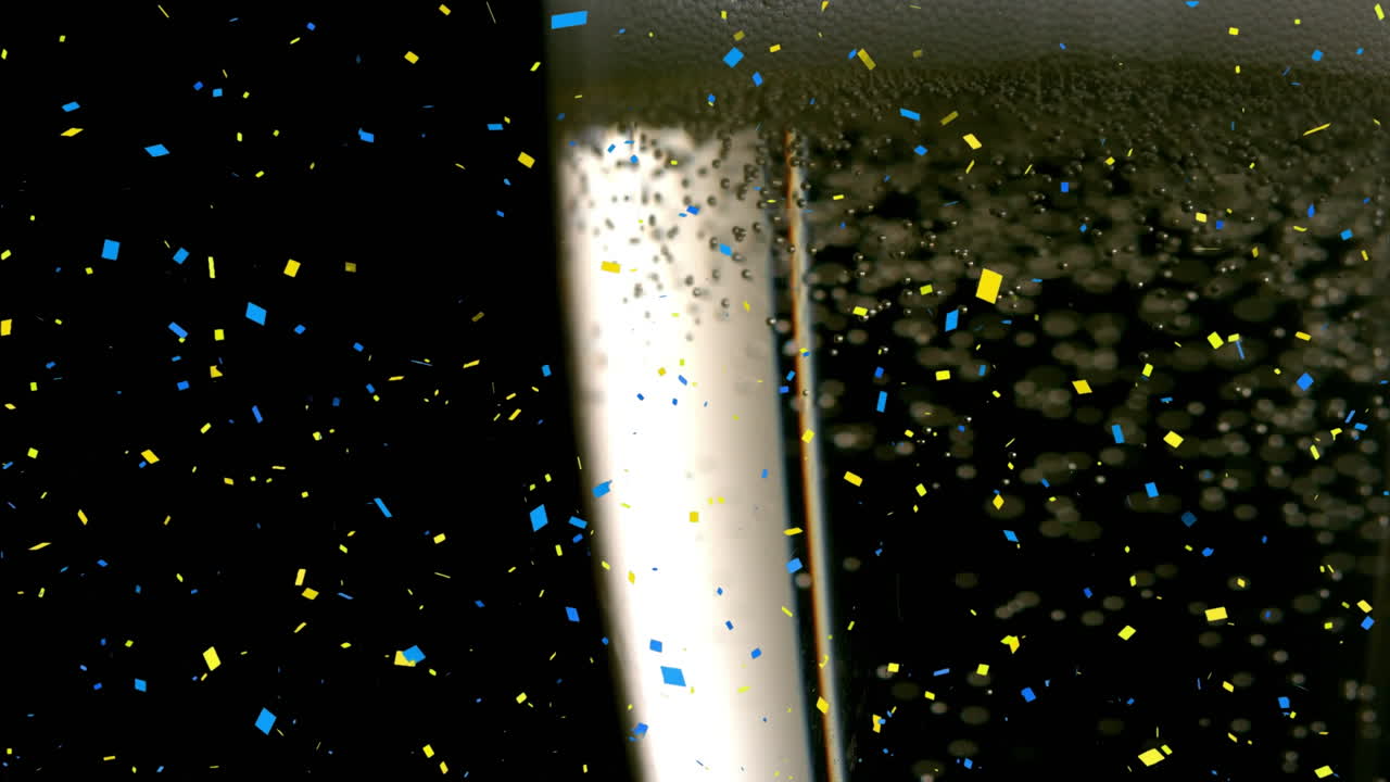 Animation de confettis tombant et d'un verre de champagne sur fond noir
