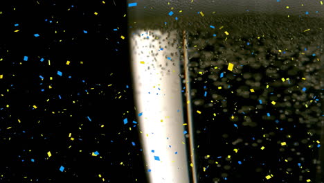 animation of confetti falling and glass of champagne on black background