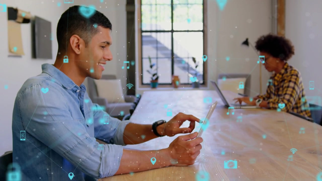Young Man Using Tablet in Modern Office with Digital Network Overlay