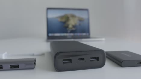 laptop accessories and power bank on a table