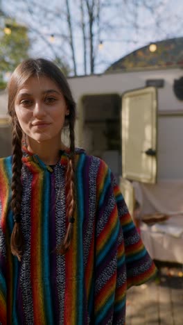 teenage girl in a striped poncho