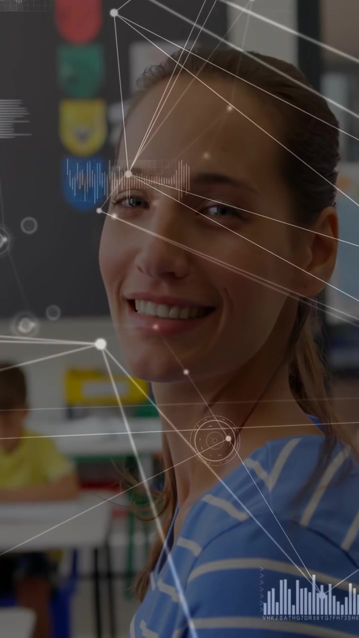 Vertical video: Teacher seeing lens, turning and smiling, greeting class while HUD tracking face