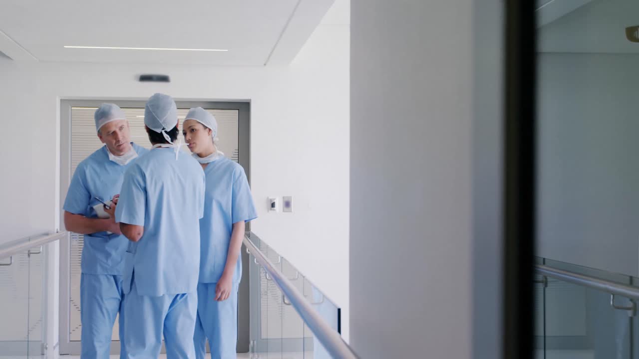 Team of surgeons discussing over medical reports