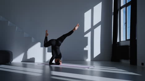 woman practicing yoga in a studio